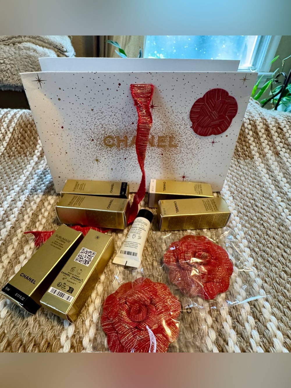 CHANEL Gold Skincare Set with Red Camellia Accents